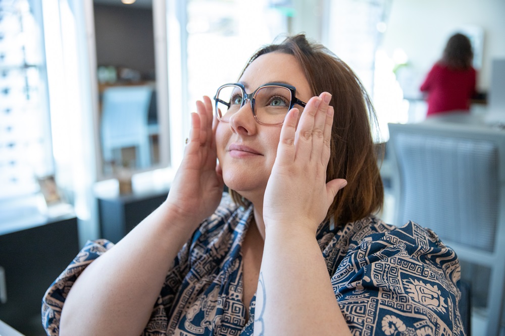 Woman fitting eye glasses - Optical Glasses in Carrboro, NC